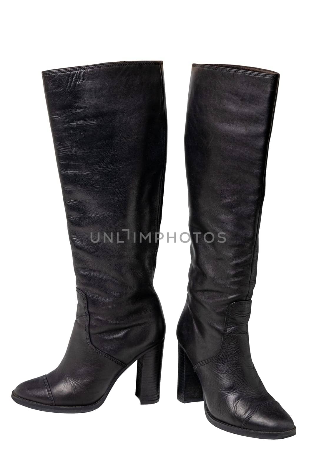 A pair of black elegant female boots or woman shoes isolated on a white background. Leather boots.