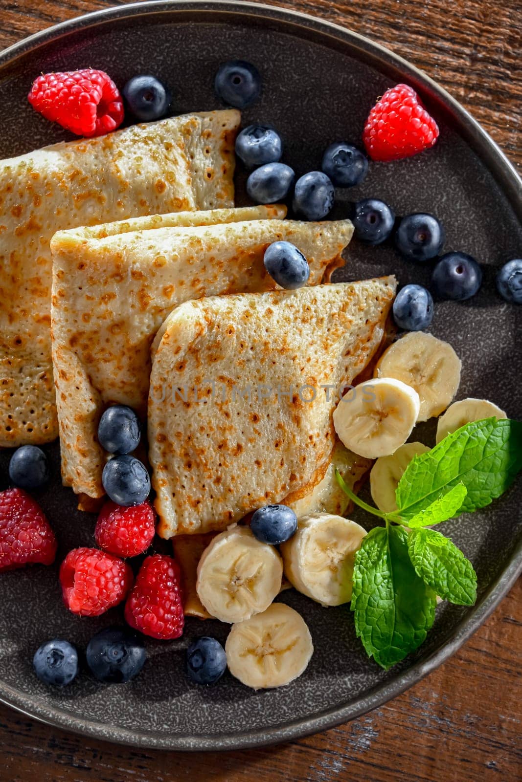 A plate of home-made Polish pancakes filled with sweet cottage cheese