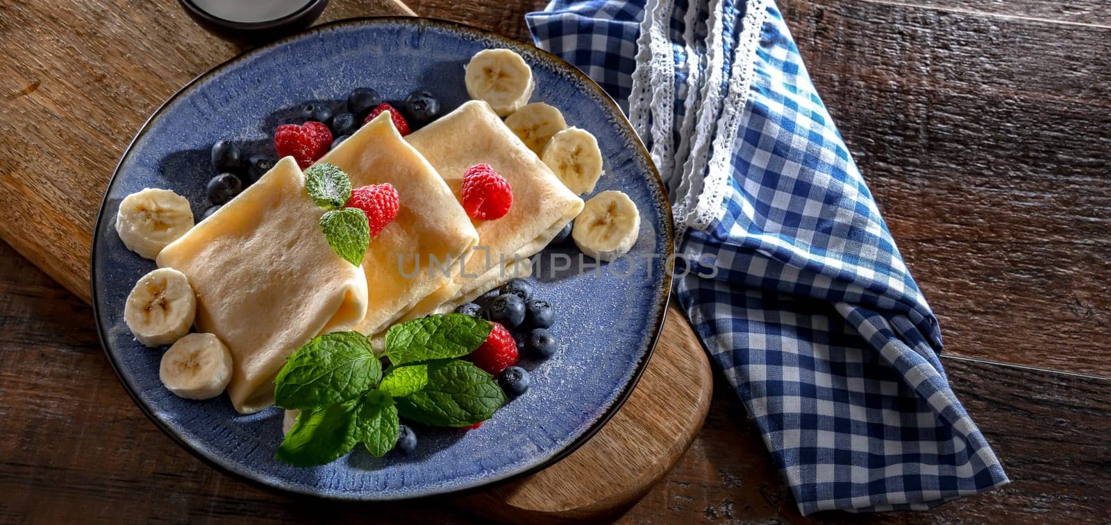 A plate of home-made Polish pancakes filled with sweet cottage cheese