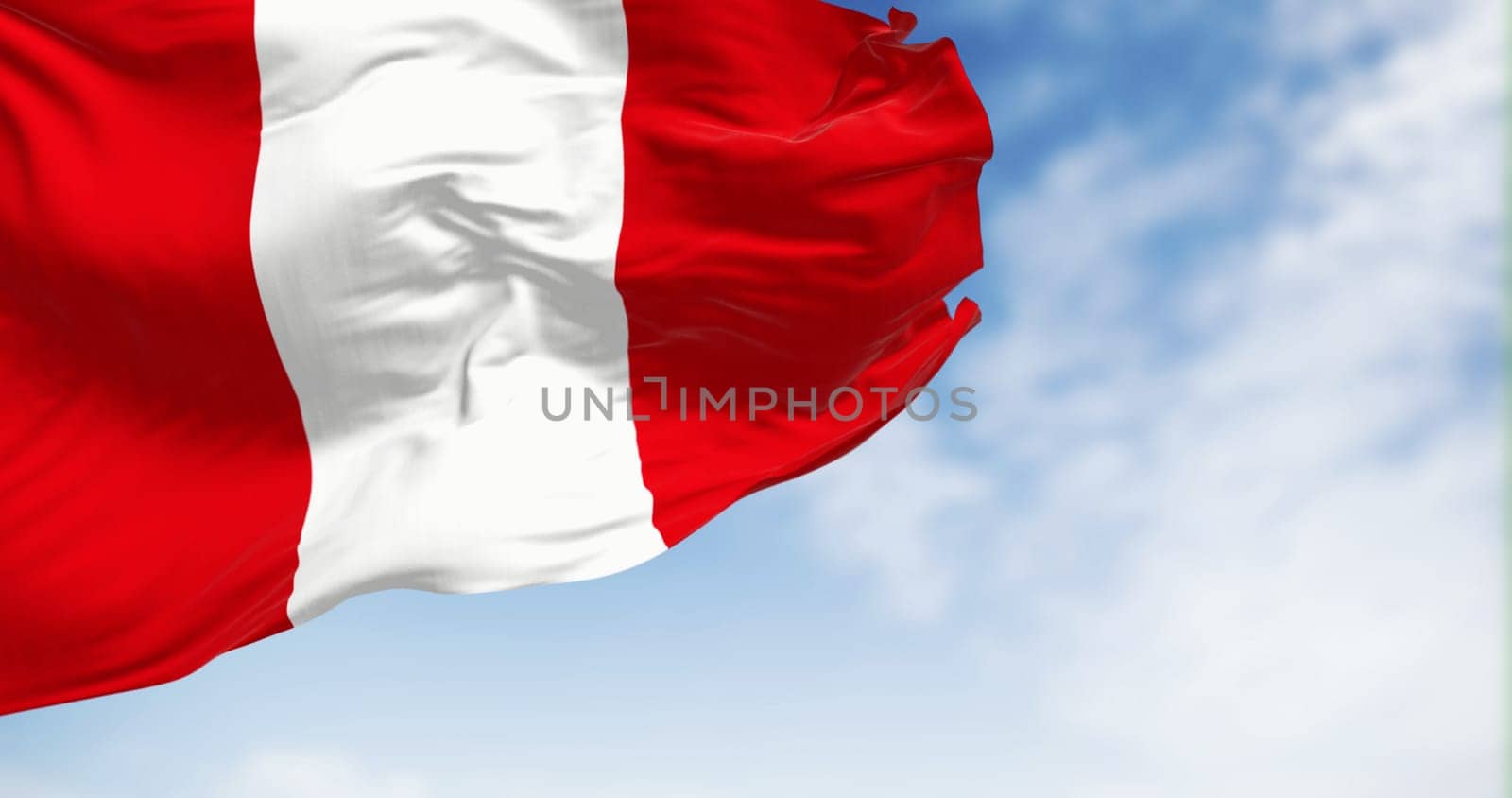 Peru national flag waving in the wind on a clear day. Vertical tri-band consisting of two red outer bands and a single white middle band. 3d illustration render. Fluttering fabric