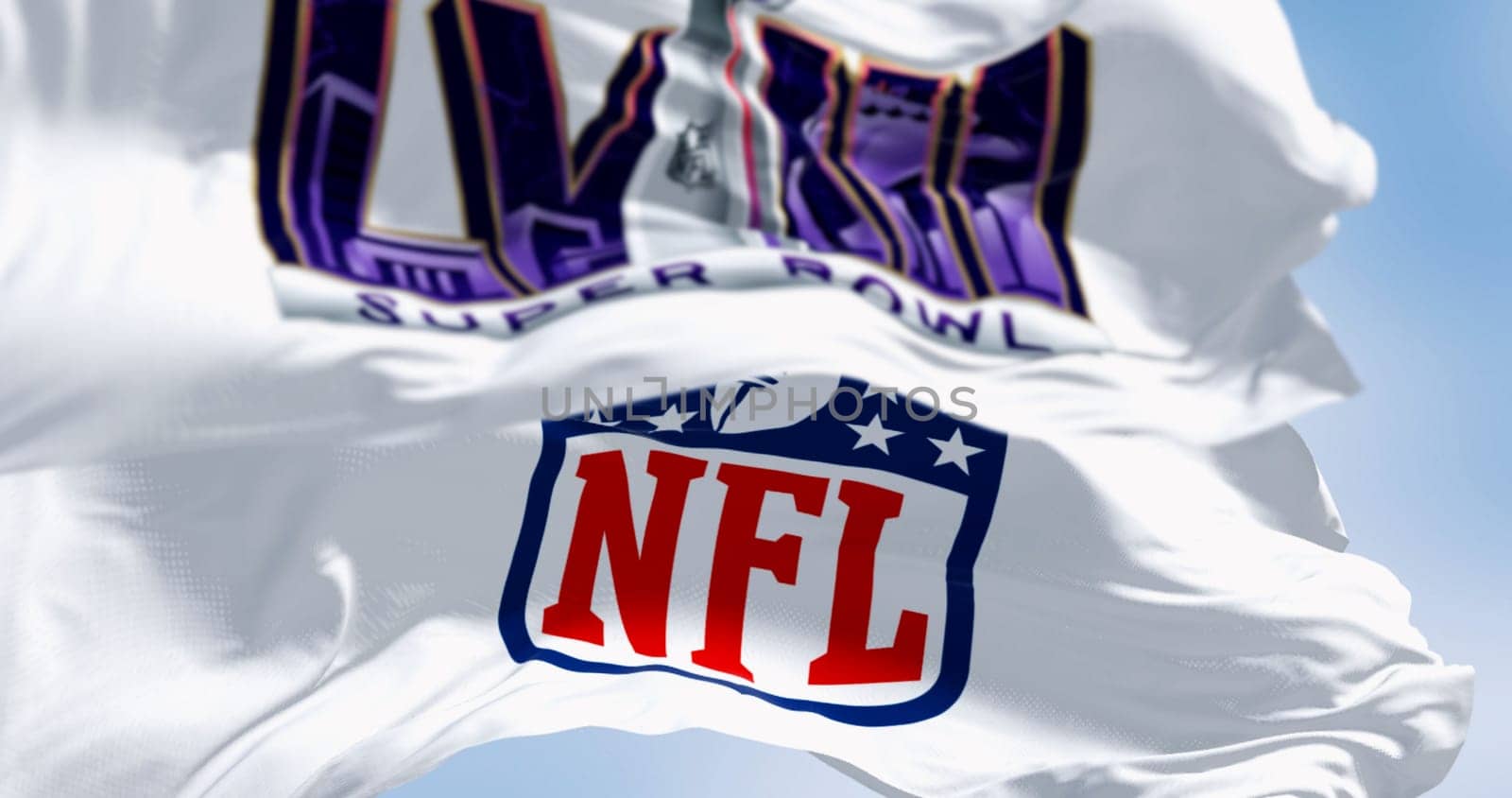 Paradise, US, June 2023: 58th Super Bowl and NFL flags waving. The game is scheduled to be played on Feb 11, 2024 in Paradise, Nevada. Illustrative editorial 3d illustration render. Selective focus