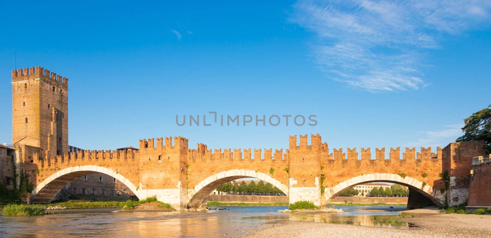 Verona, Italy. Castelvecchio bridge on Adige river. Old castle sightseeing at sunrise