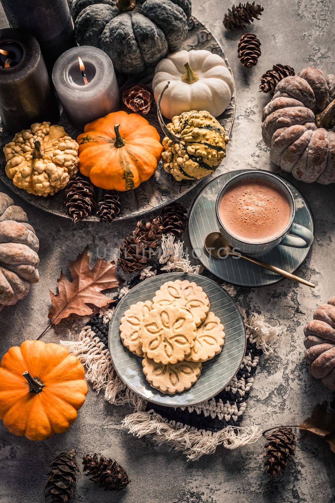 Chai chocolate  or hot cacao with chai cookies, pumpkins for Thanksgiving breakfast. Cozy autumn still life, hygge.