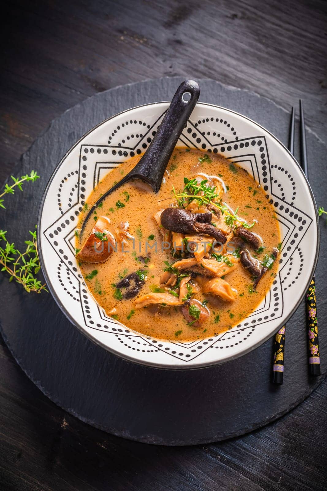 Homemade miso mushroom soup with coconut milk, with assorted edible mushrooms