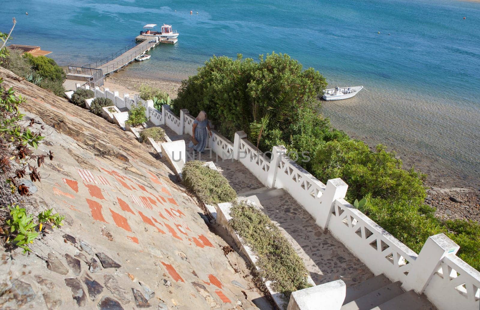 Vila Nova de Milfontes. little picturesque town on the Alentejo coast, Portugal. Stairs from pier to Barbaca Square