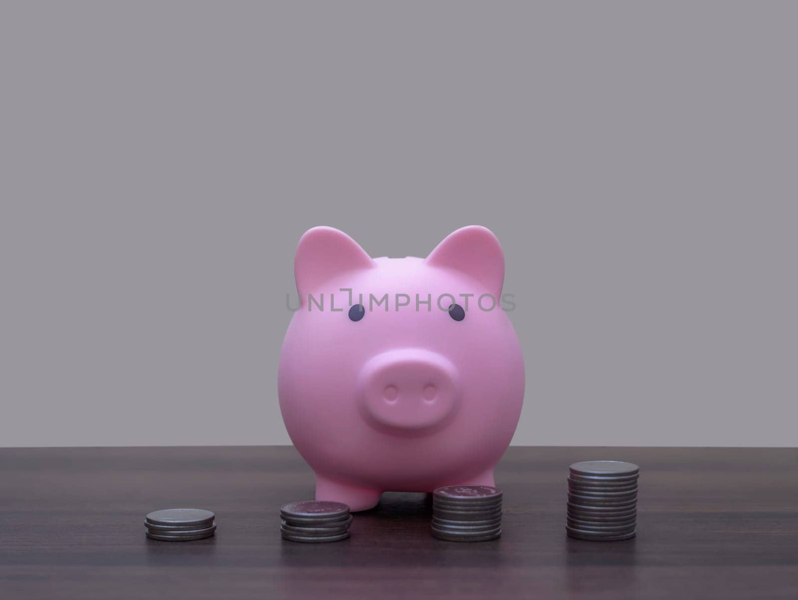 Save money and account banking for finance concept, Piggy bank with coin on blurred background, Save Monney for Investors Using Internet to Trade Stocks or Trade Fund