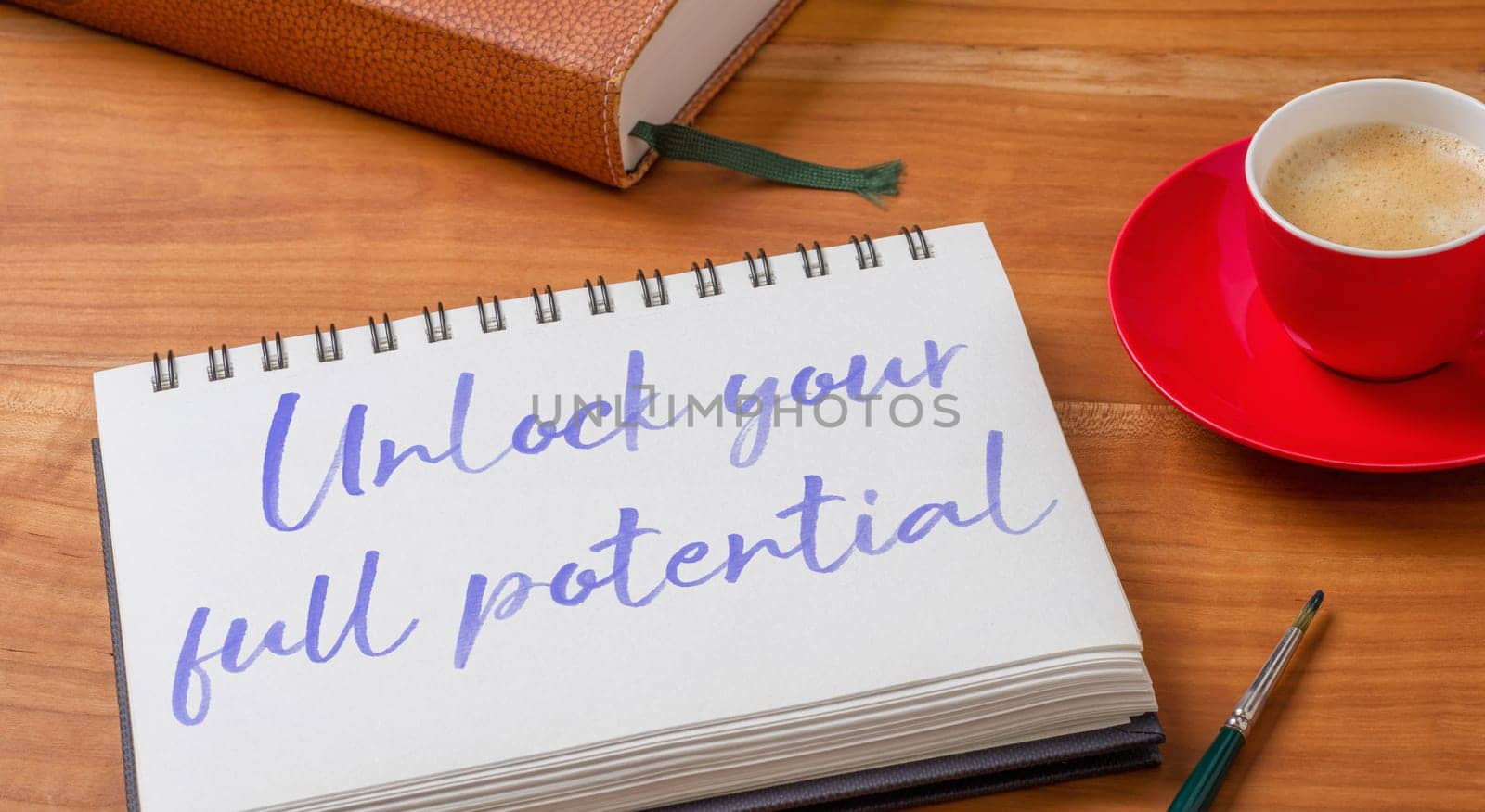 Notepad on a desk - Unlock your full potential