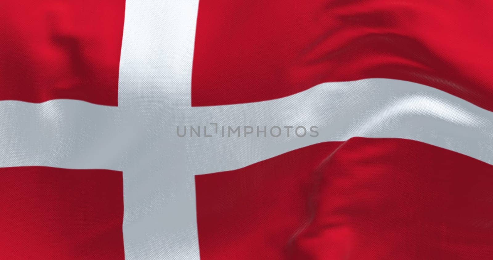 Denmark national flag waving on a clear day. Red flag with a white Scandinavian cross extending to the edge of the flag. 3d illustration render. Fluttering fabric