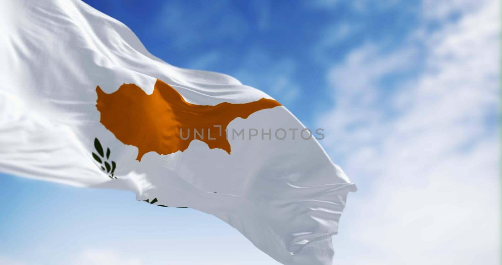 Cyprus national flag waving on a clear day. White flag with two olive branches under the dark orange map of the whole island. 3d illustration render. Fluttering fabric