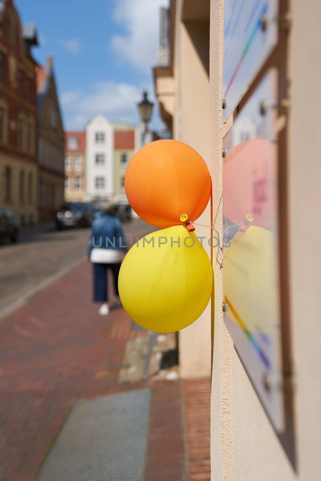 Balloons indicating a company anniversary on the facade of a commercial building in the old town of Wismar in Germany