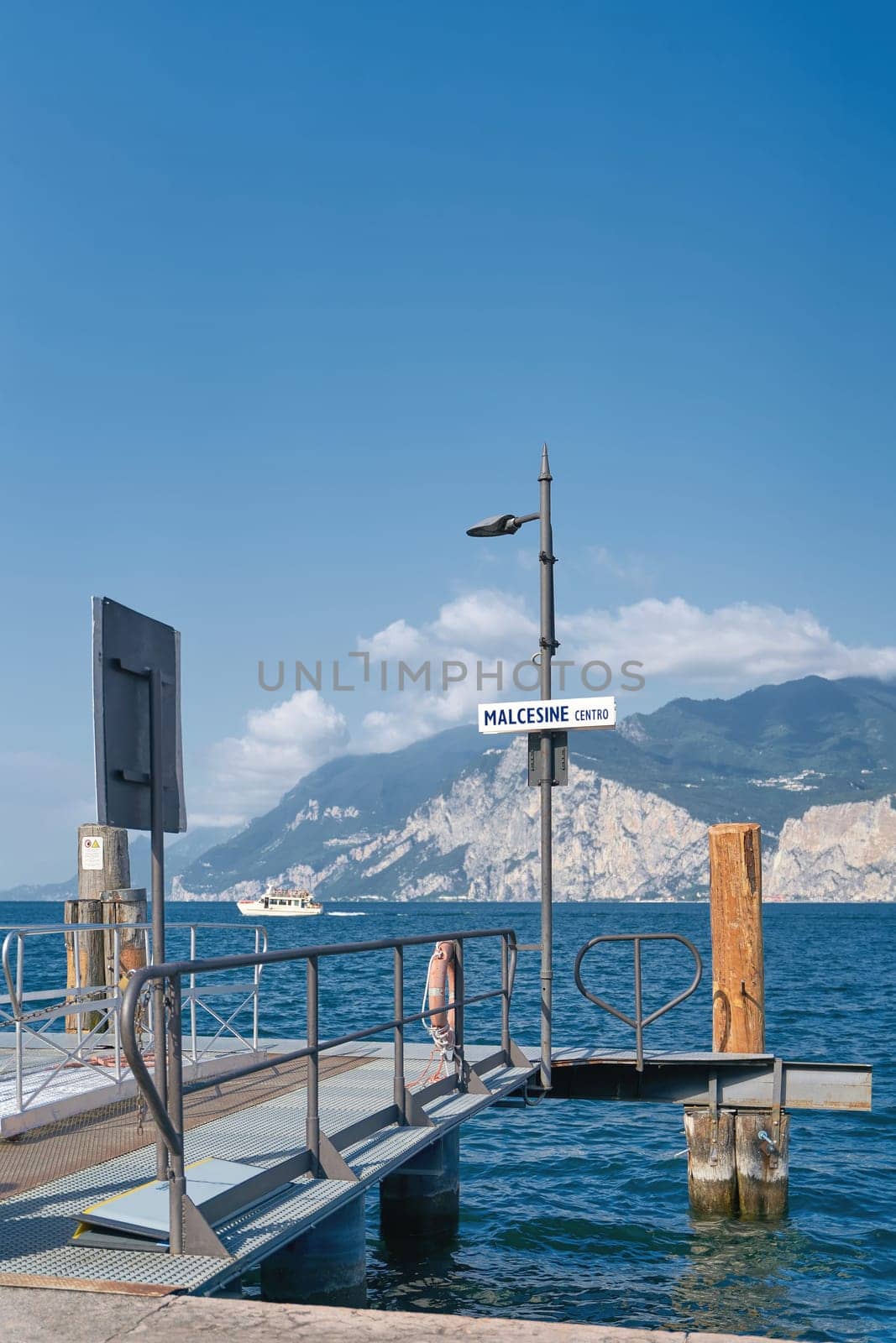 Pier for ferry service on the shore of Lake Garda in Malcesine Centro in Italy
