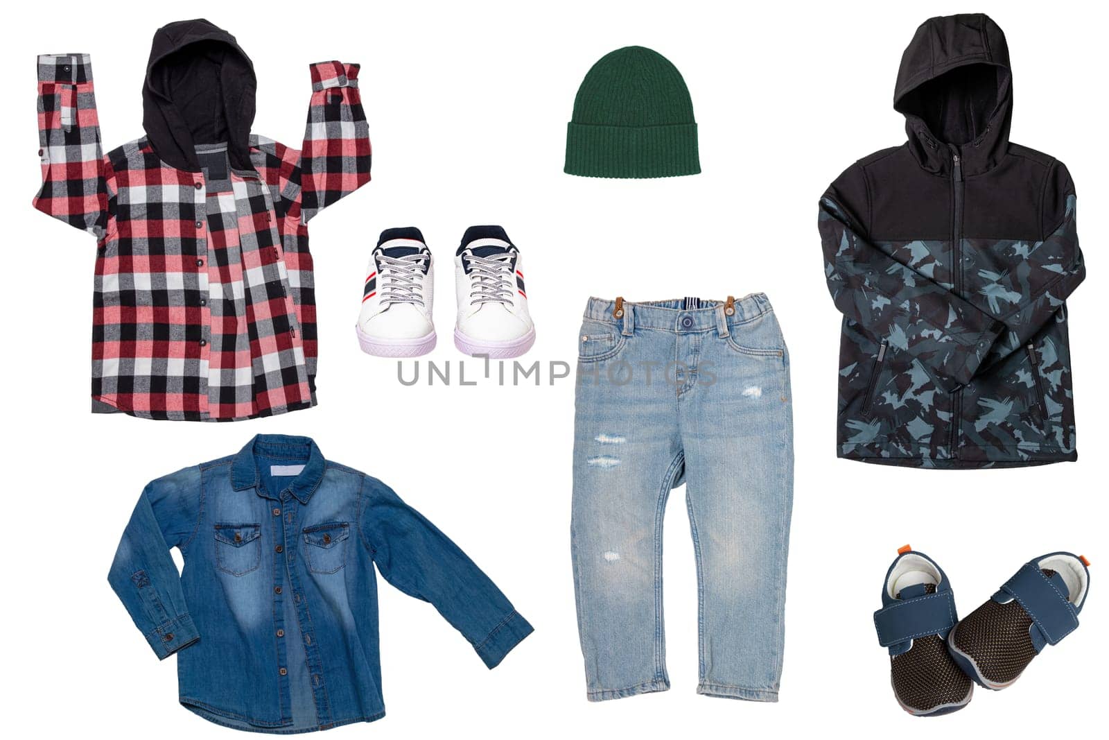 Collage set of little boys autumn clothes isolated on a white background. Denim trousers and jacket, sneaker, a down jacket, pants and hood for child boy. Children's winter fashion.
