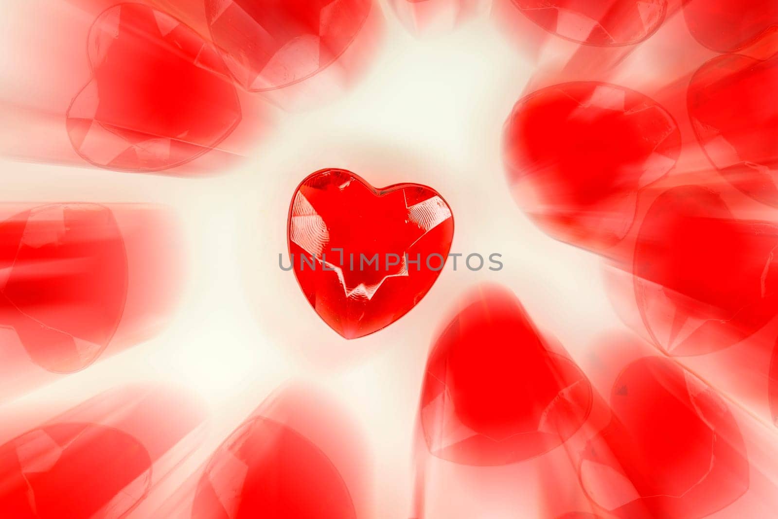 Heart on white paper with copy space and blurred other hearts
