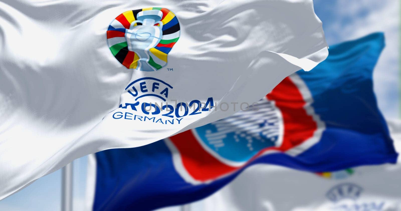 Berlin, DE, June 30 2023: UEFA and UEFA Euro 2024 European Football Championship flag waving on a clear day. International Sport event. Illustrative editorial 3d illustration render