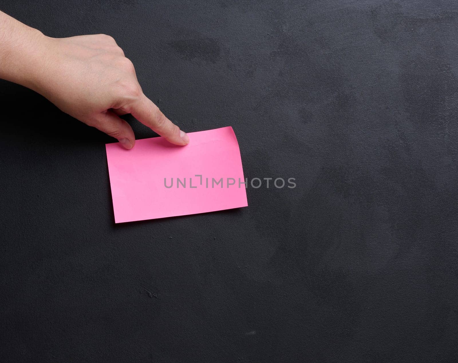 Representing the concept of searching for solutions and answers to questions, hand hold paper sticker
