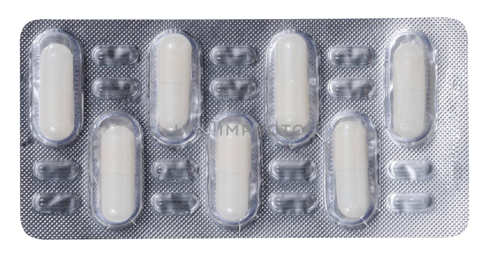 Oval white tablets in blister pack on a white isolated background, top view