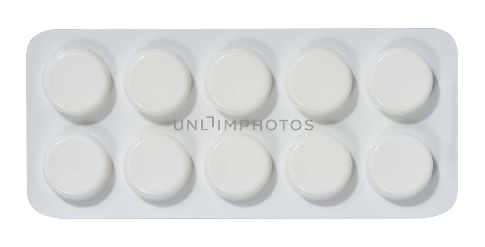 Round tablets in white plastic packaging, top view