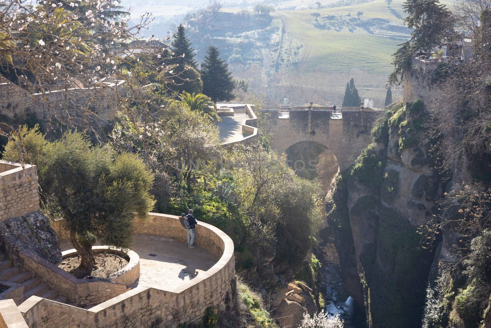 Panoramic view of hanging gardens of Cuenca over El Tajo Gorge with whitewashed houses of Ronda, Andalusia, Spain