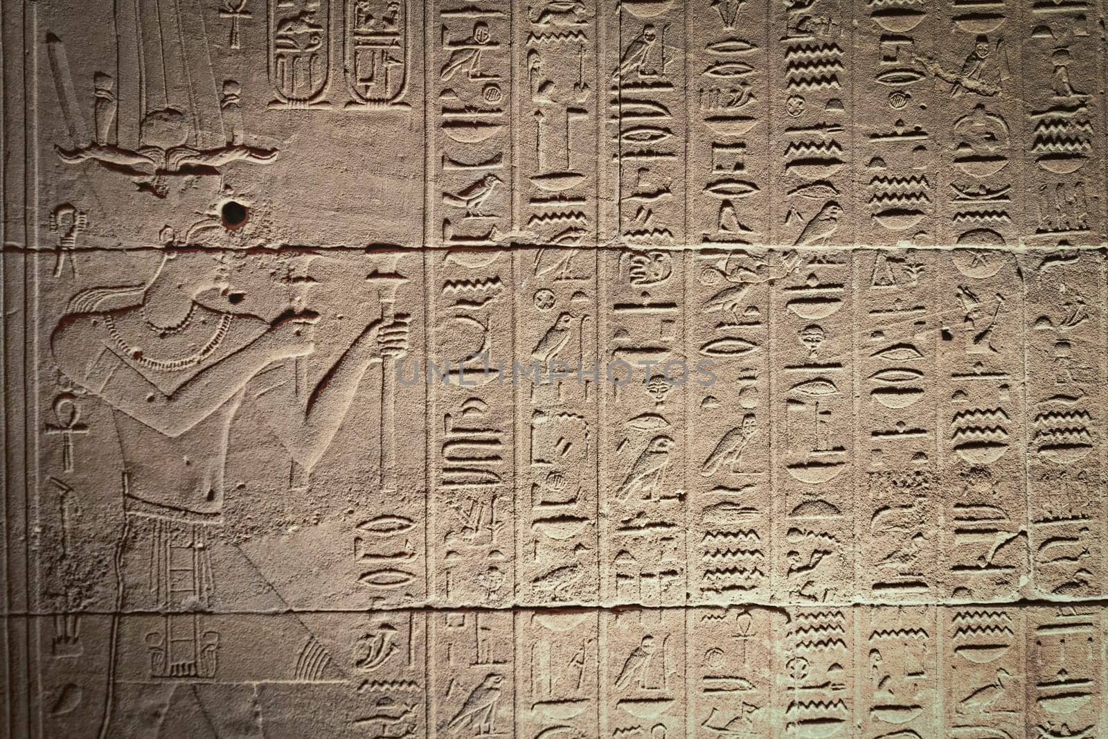Old Egyptian hieroglyphs on an ancient background. Horizontally.