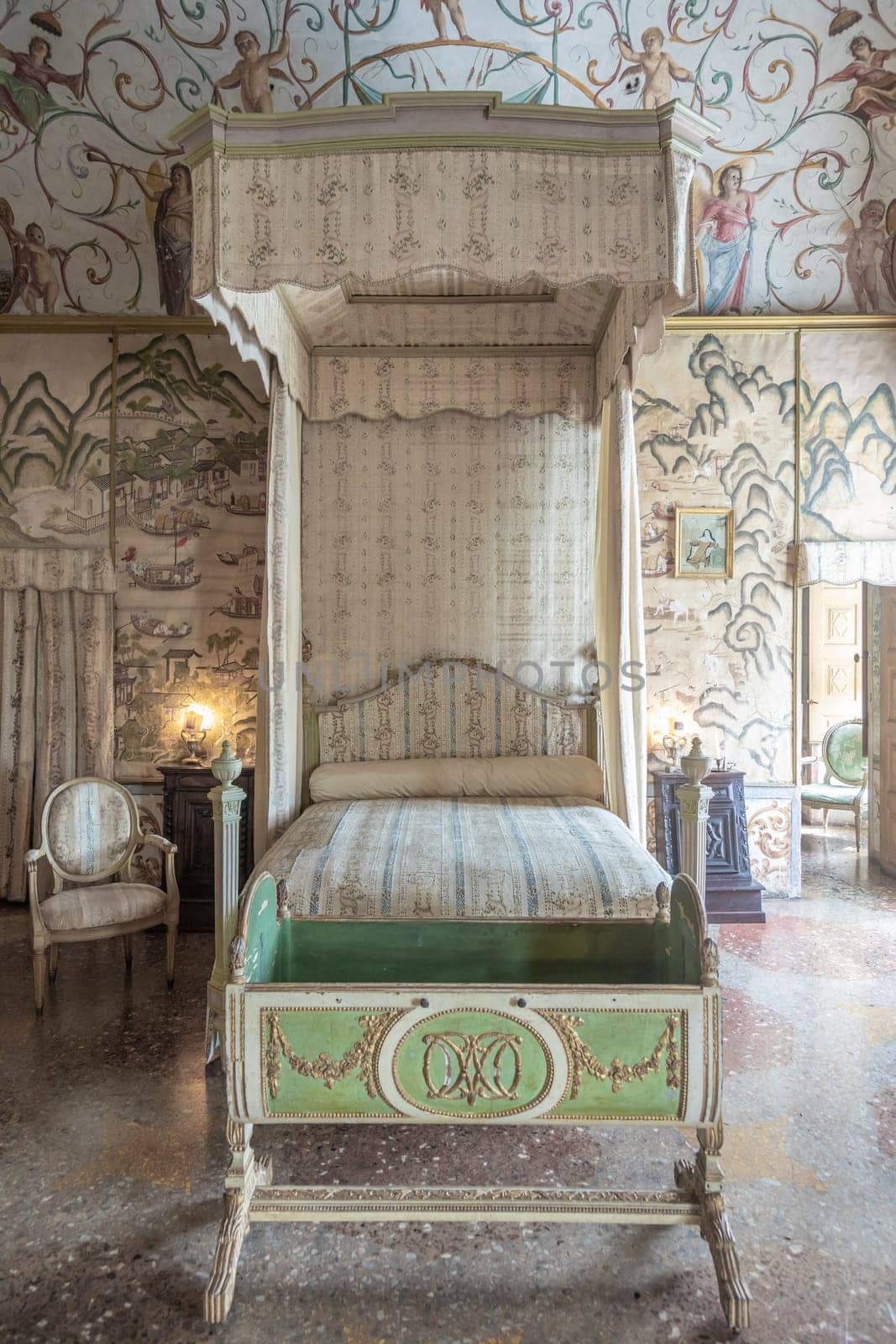 Masino, Italy - April 2023: baroque bedroom in old castle. Vintage interior, original from 18th Century