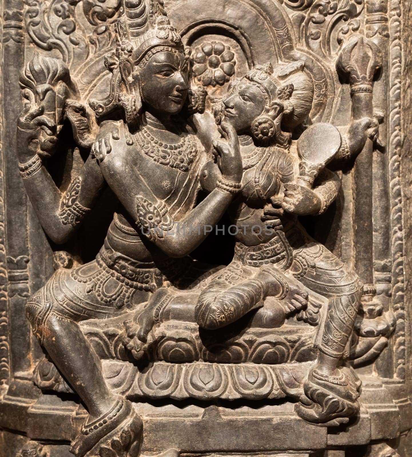 Turin, Italy - April, 2023: Oriental Art Museum. Shiva and Parvati, 10th Century A.D. For Hinduism religion the couple is symbol of love and devotion - traditional practice of sex, tantra and kamasutra