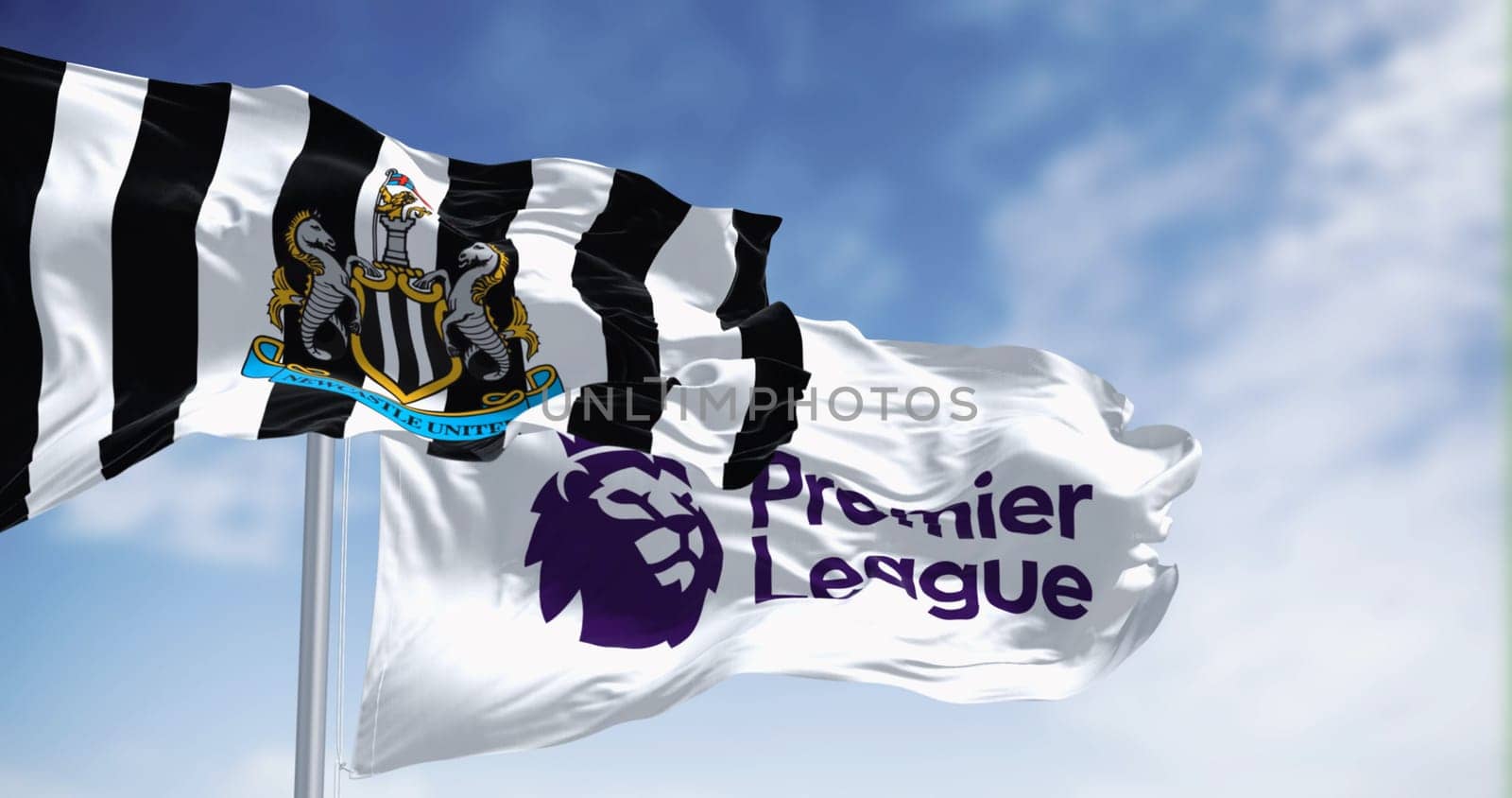 Newcastle, UK  sept. 14 2023: Newcastle Football Club and Premier League flags waving together on a clear day. Illustrative editorial 3d illustration render. Fluttering fabric. Selective focus