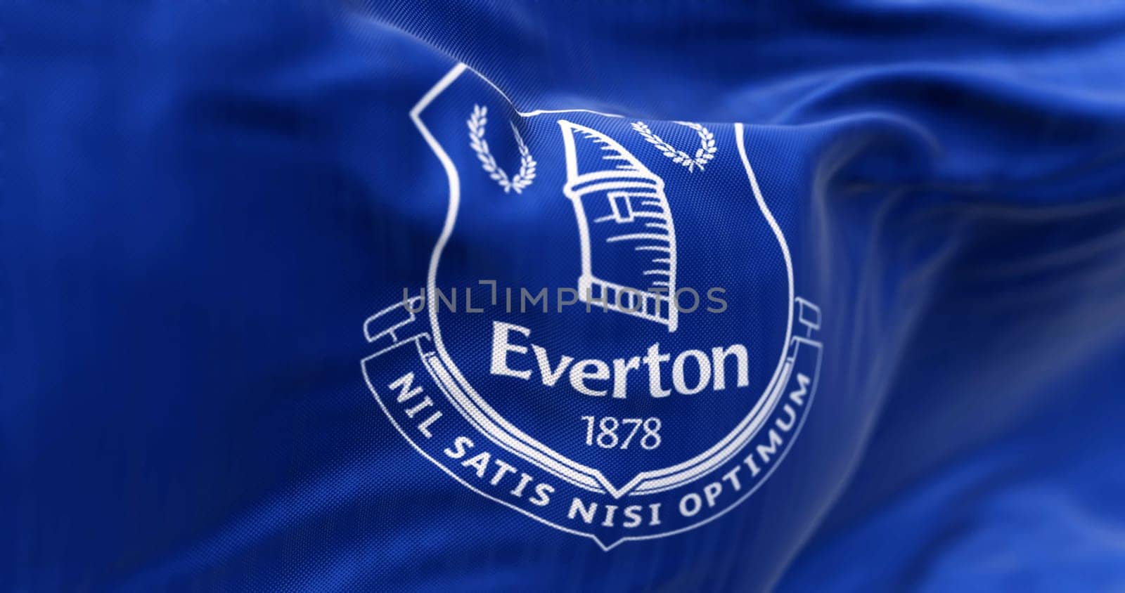 Liverpool, UK, Sept. 21 2023: Close-up of Everton Football Club flag waving. Professional english football club. Illustrative editorial 3d illustration render. Rippled fabric background