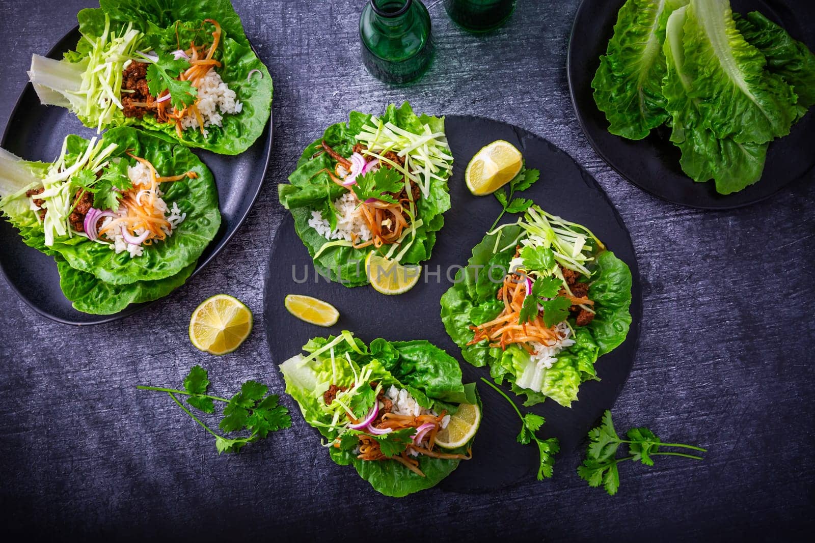 Asian minced meat lettuce wraps with rice, bean sprouts and cabbage