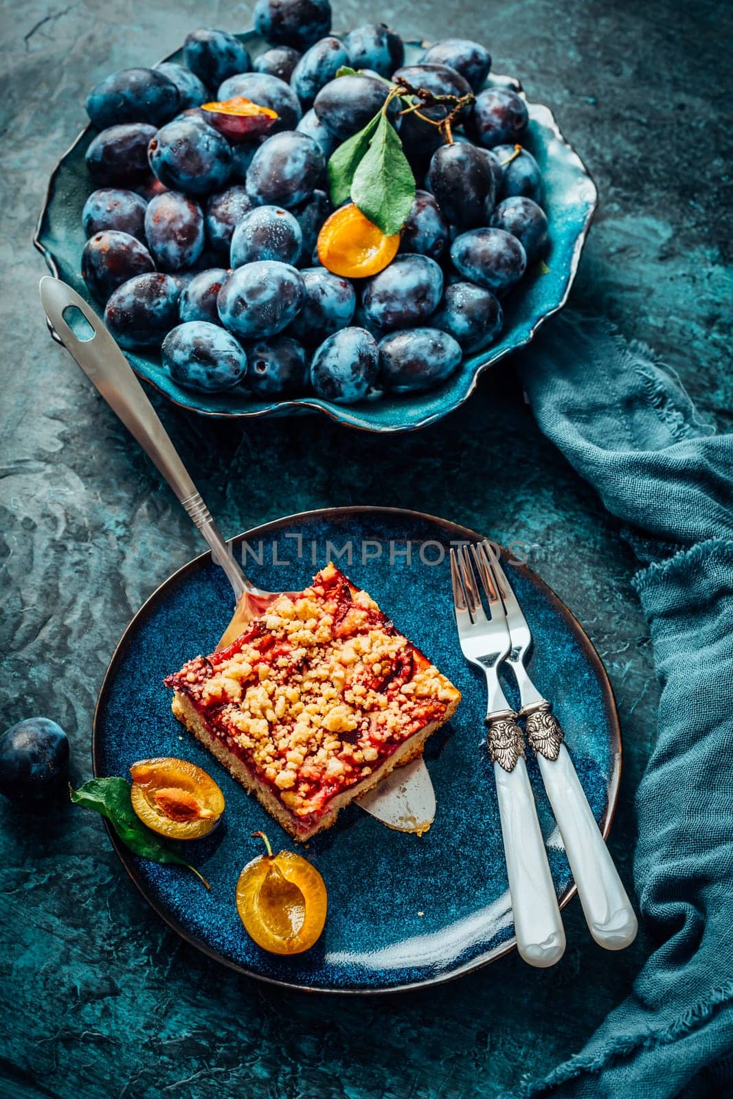 Homemade German plum cake (Zwetschgenkuchen) with yeast dough and crumbles