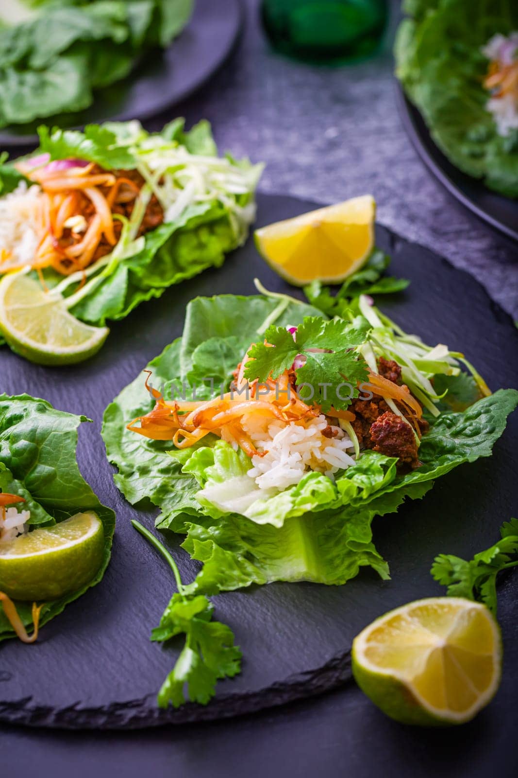 Asian minced meat lettuce wraps with rice, bean sprouts and cabbage
