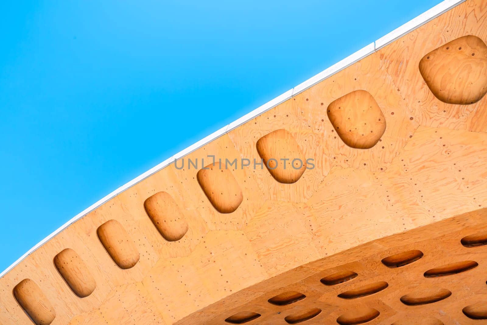 Detail of wooden roof with blue sky