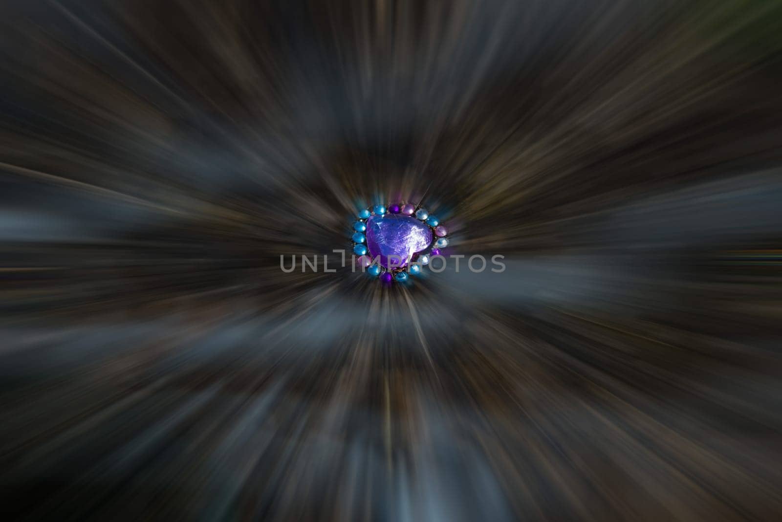 glittering, lost heart behind a fence, center in focus, background blurred