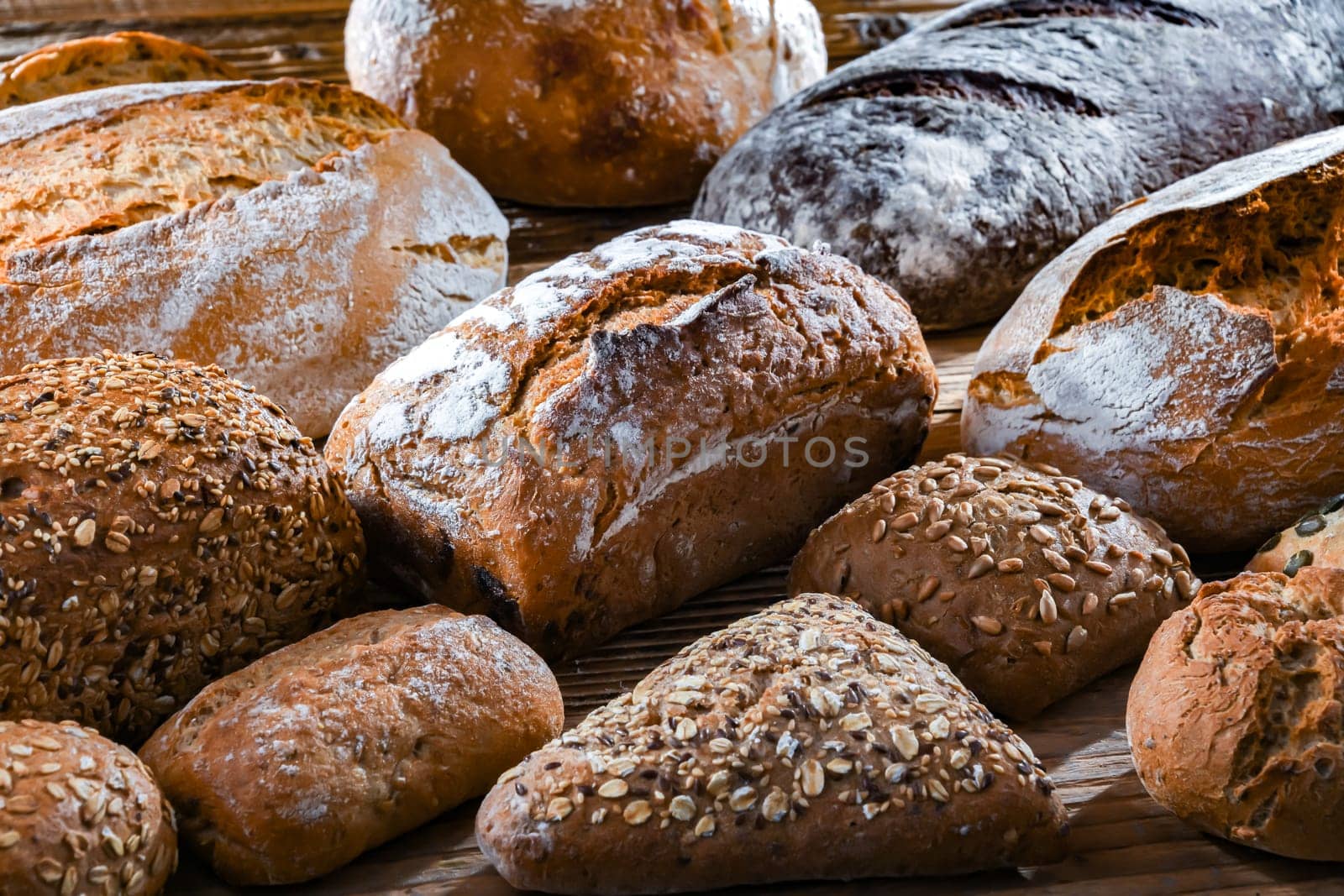 Assorted bakery products including loaves of bread and rolls