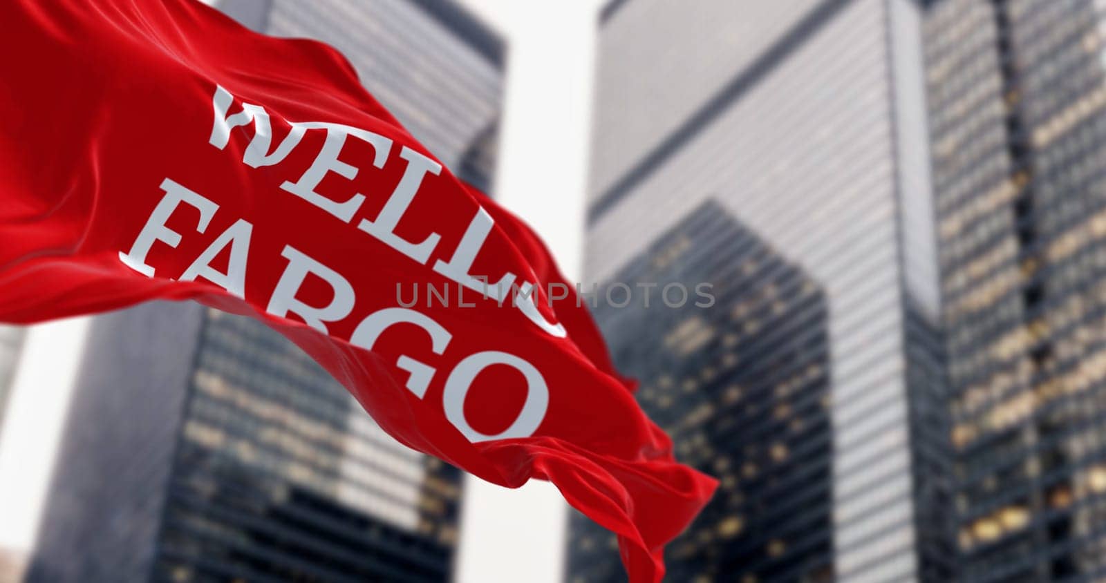 San Francisco, US, Aug. 1 2023: Close-up of Wells Fargo bank flag waving in a financial district. Illustrative editorial 3d illustration. Finance and banking