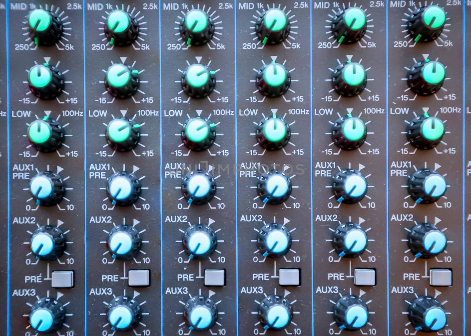 A close-up of a controller panel with sliders and controllers.