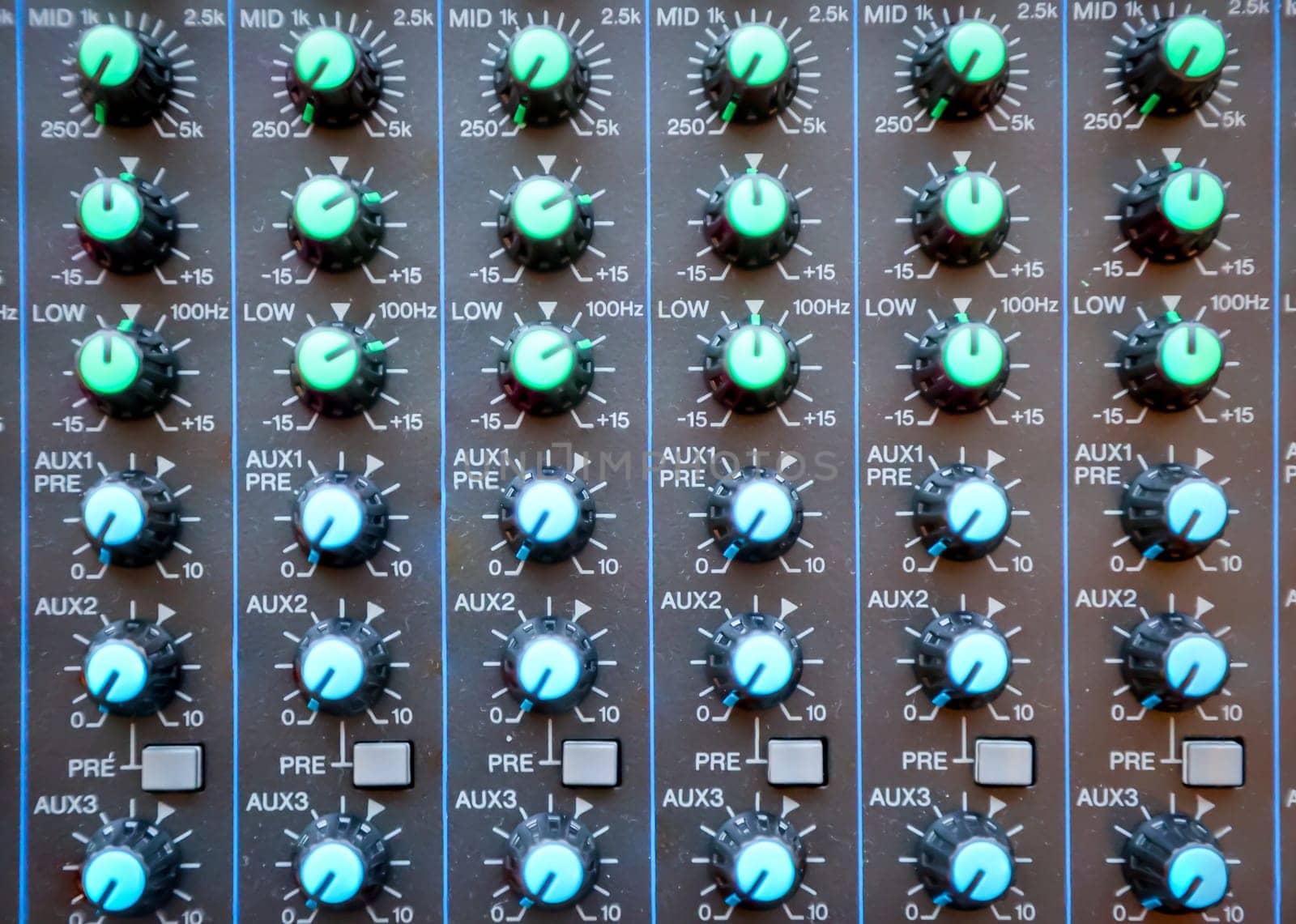 A close-up of a controller panel with sliders and controllers.