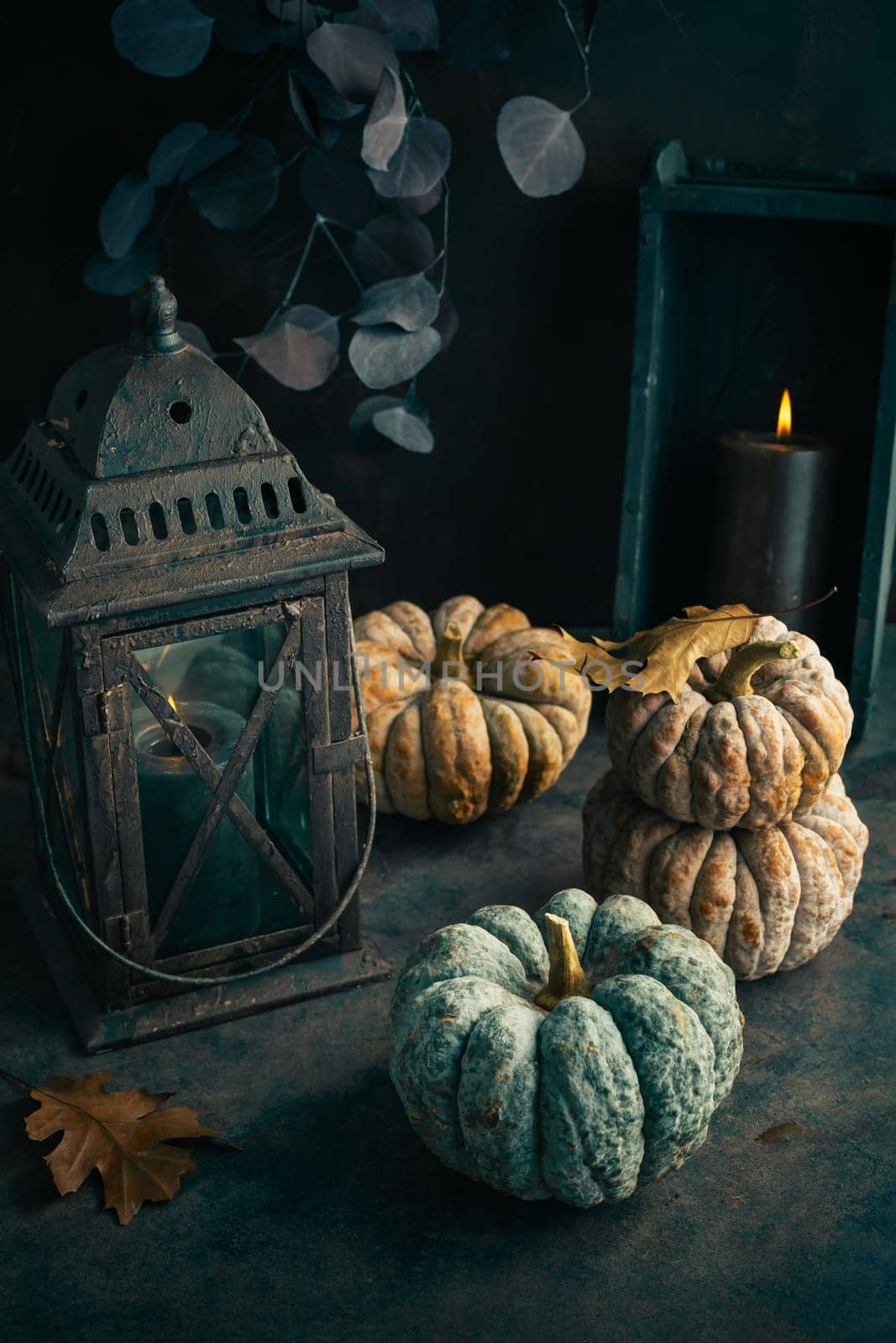 Fall candle decoration with  pumpkins, wooden home decor still life scented candle, autumn season interior decoration details