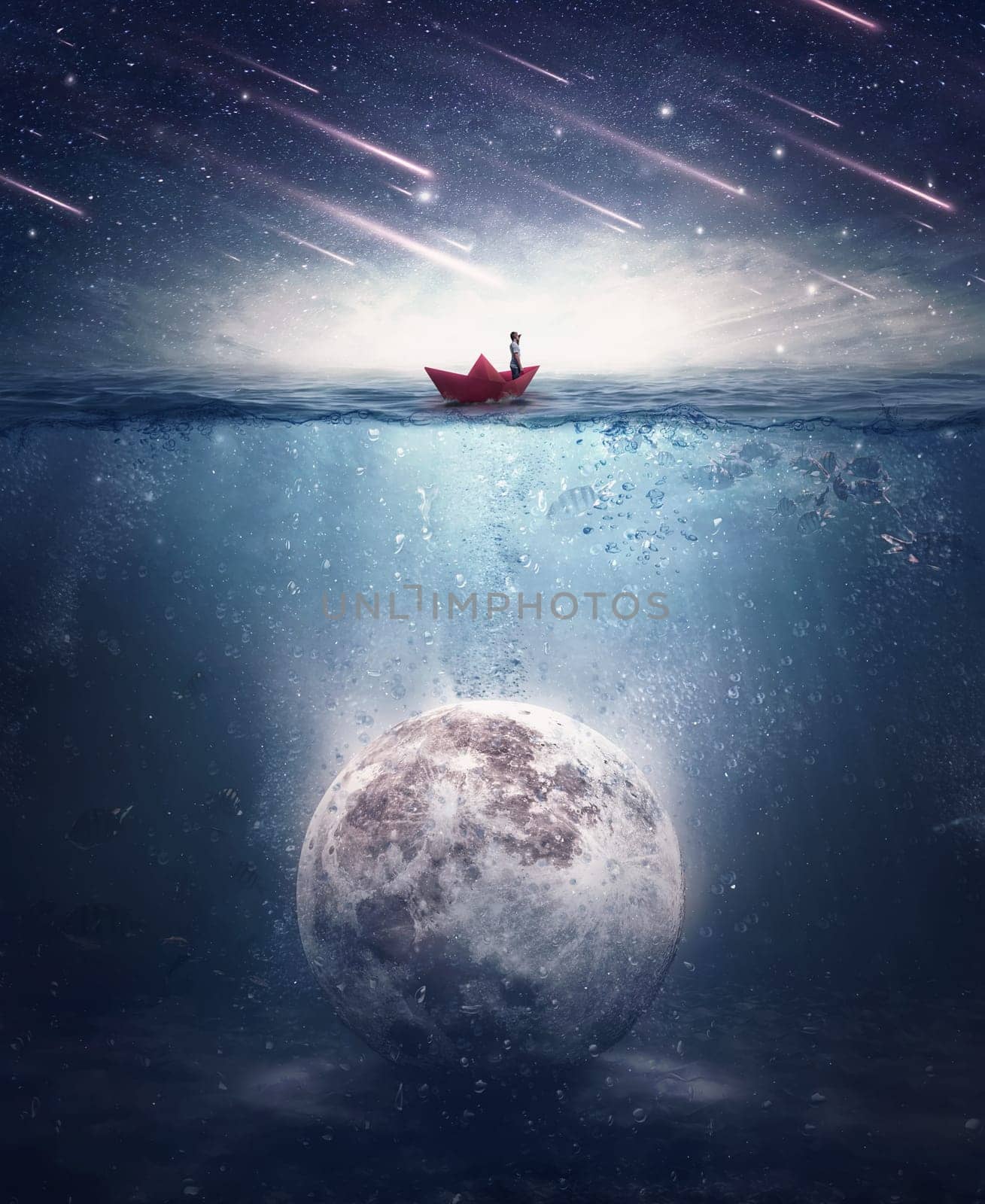 Boy sailing in a paper boat searching for the moon sunken underwater. Satellite drowned in the ocean water in a mysterious night with falling stars. Surreal background, mystical adventure concept