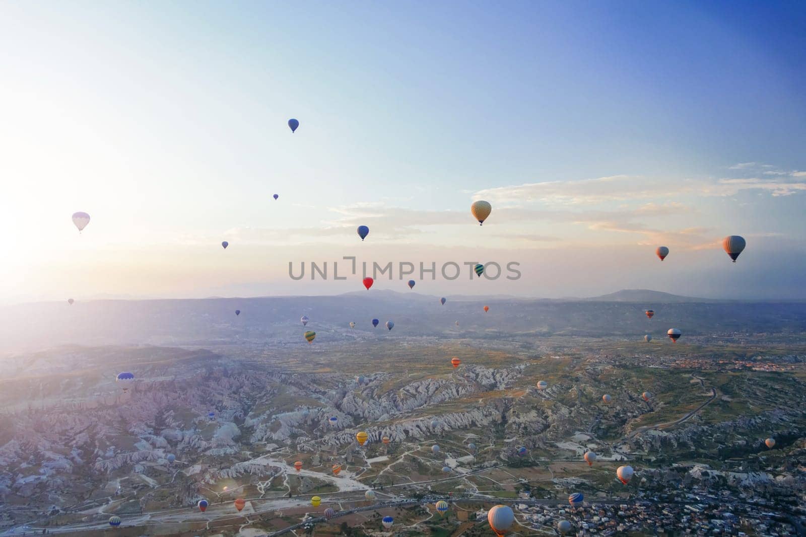 Beautiful morning scene with Hot air balloons flying over Love valley at sunrise, Tourist attraction of Cappadocia, Goreme, Nevsehir, Turkey