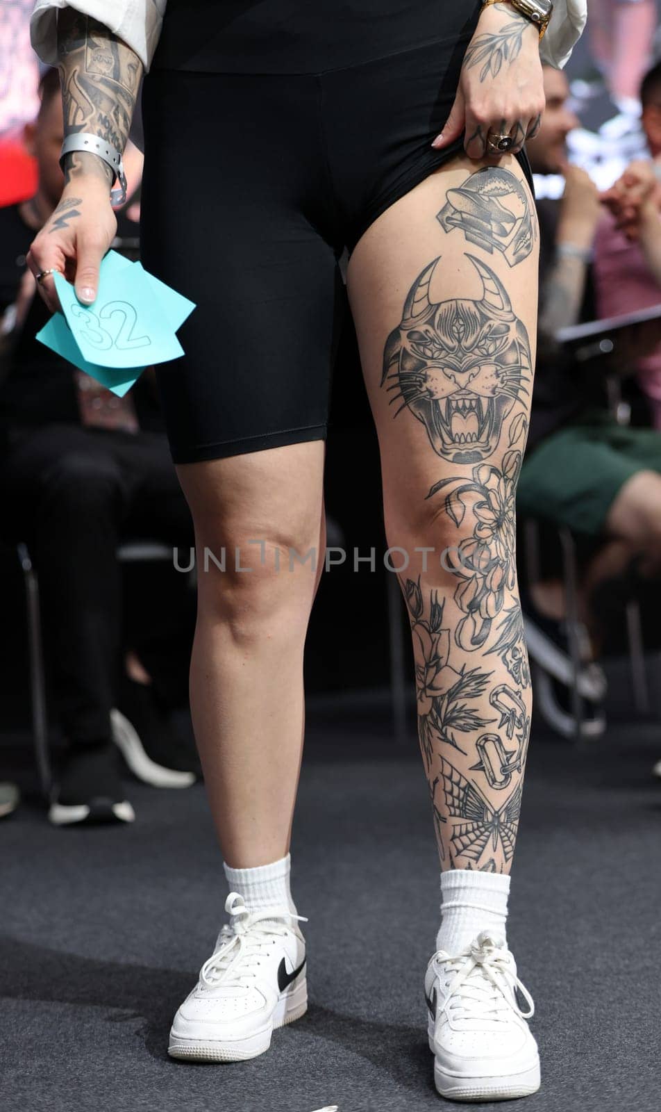 Krakow, Poland - June 11, 2022: Unidentified participant during the contest for the best tattoo at the 15th Tattoofest Convention in Cracow. One of the most prestigious tattoo festivals.