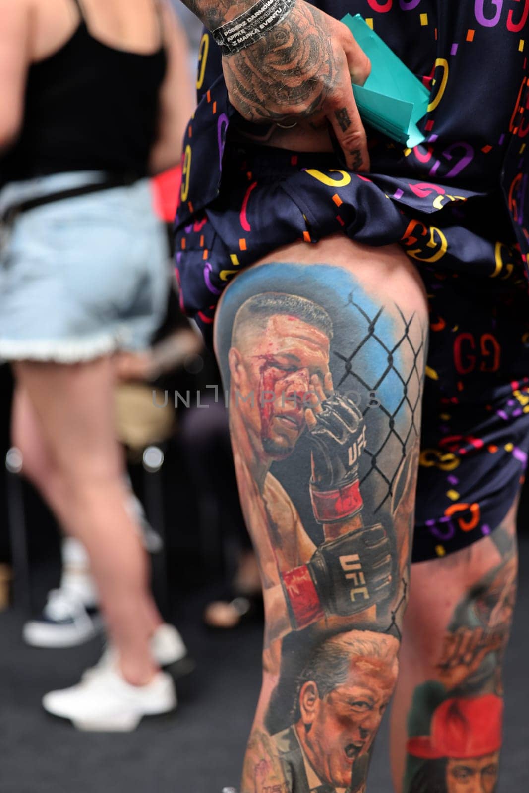 Krakow, Poland - June 12, 2022: Unidentified participant during the contest for the best tattoo at the 15th Tattoofest Convention in Cracow. One of the most prestigious tattoo festivals.
