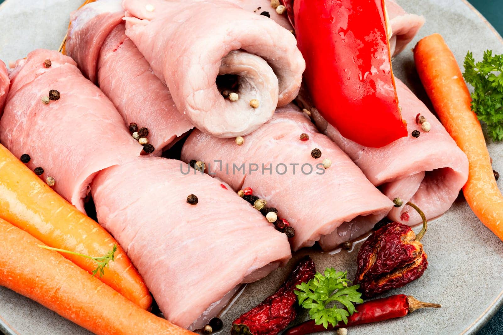 Fresh, delicious uncooked pork meat rolls and vegetable. Raw meat.