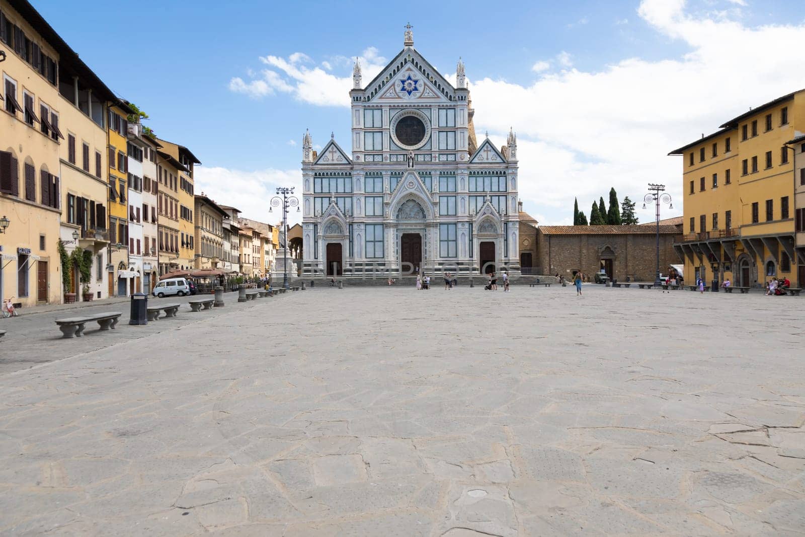 Florence, Italy - June 2022: Basilica of Santa Croce, blue sky and clouds