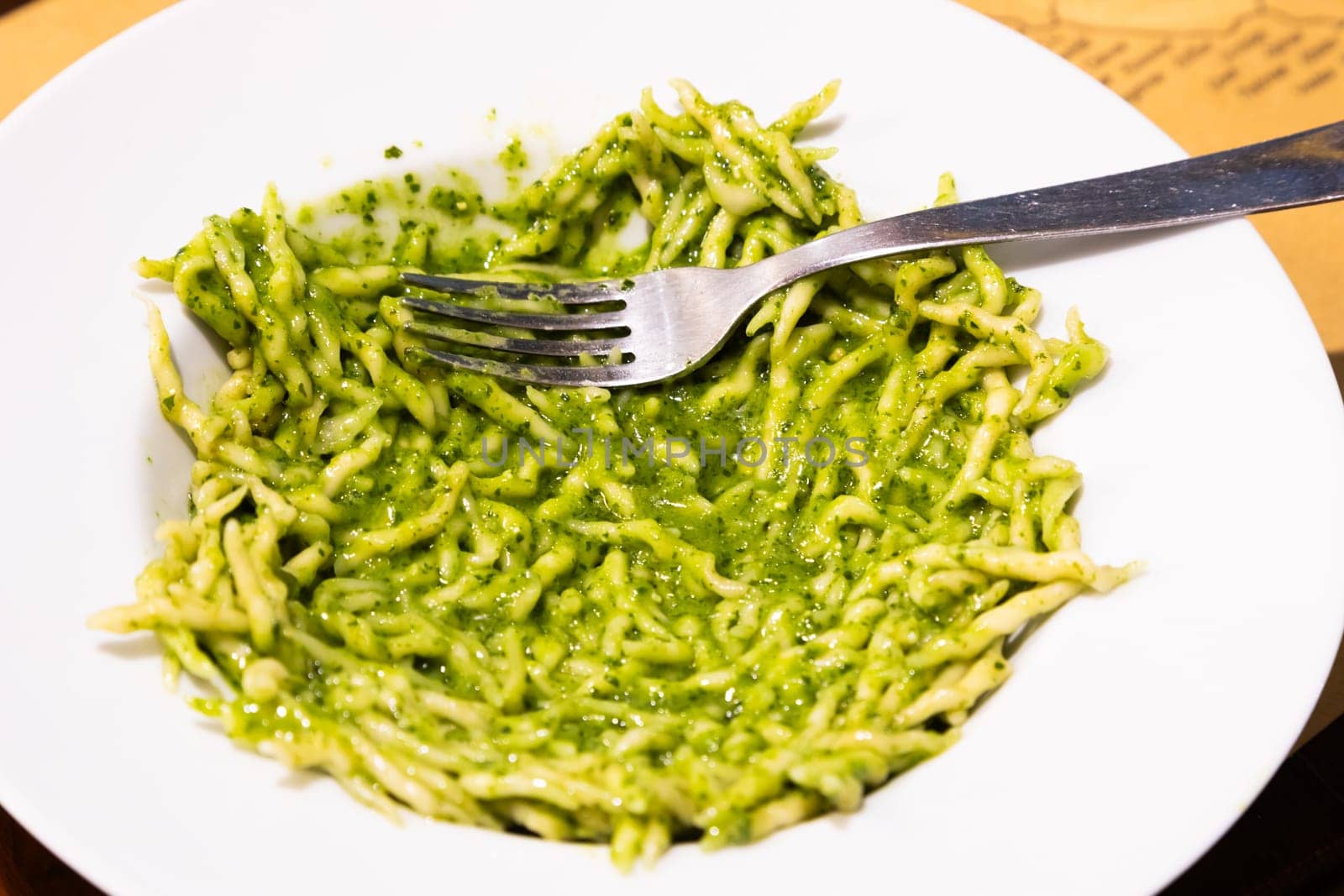 Traditional Italian food - trofie al pesto, typical regional pasta from Liguria region, with basil sauce