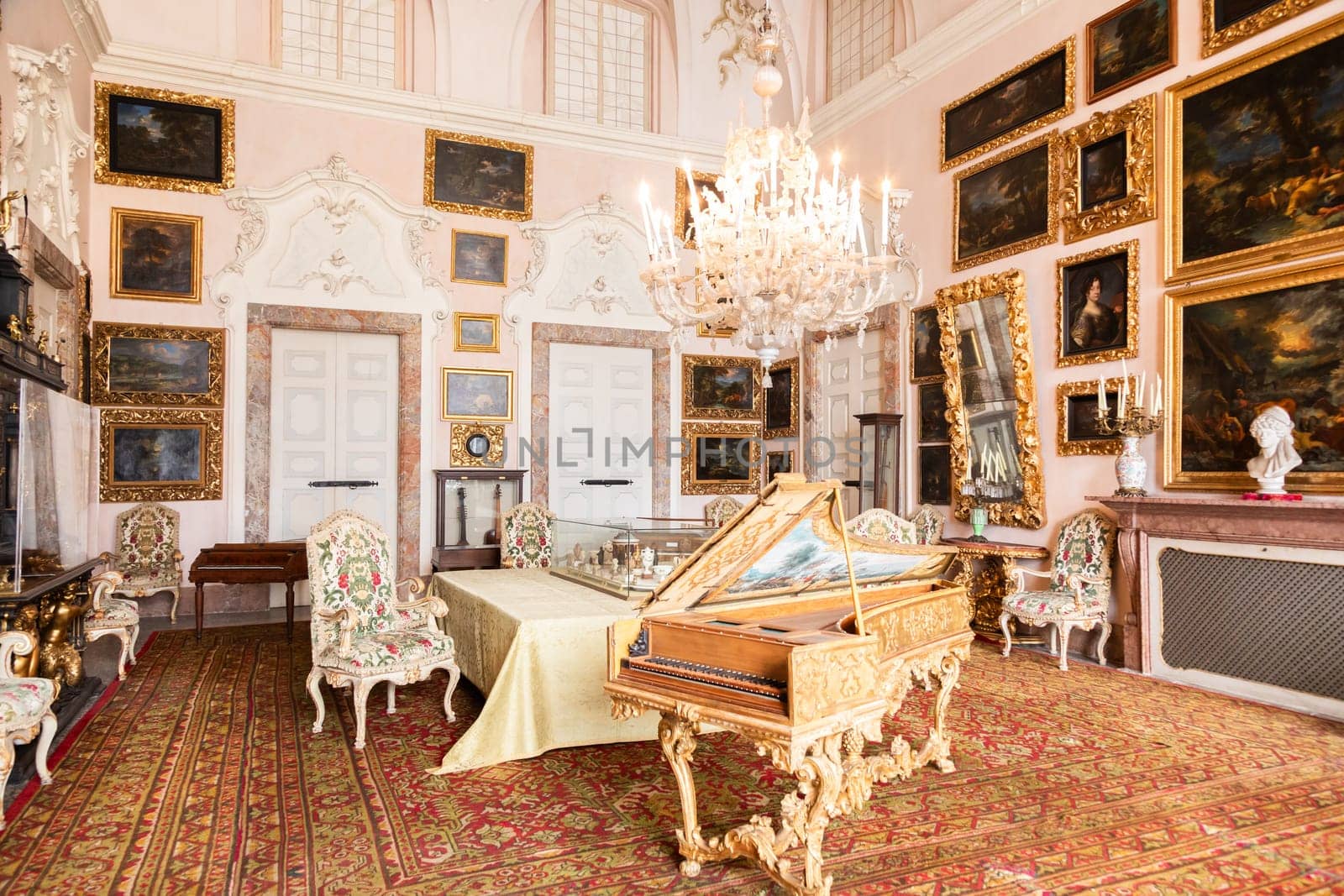 Isola Bella, Italy - 1 August 2023: Luxury old concert hall with vintage piano. Retro organ, classical musical instrument