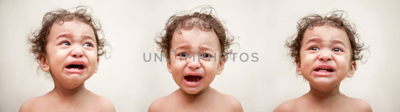 Adorable Indian baby crying a over white background