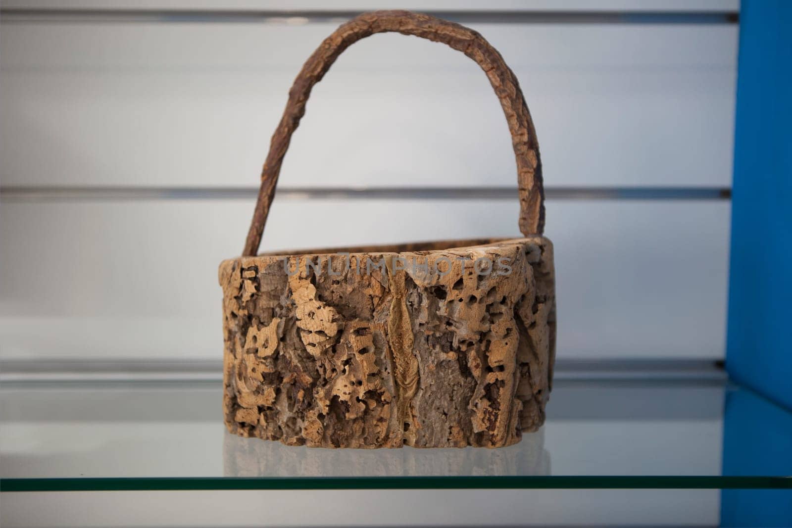 Vila Nova, Portugal - Jul 26th, 2023: Basket made of cork. Alentejo crafts displayed at tourist office, Vila Nova de Milfontes, Portugal