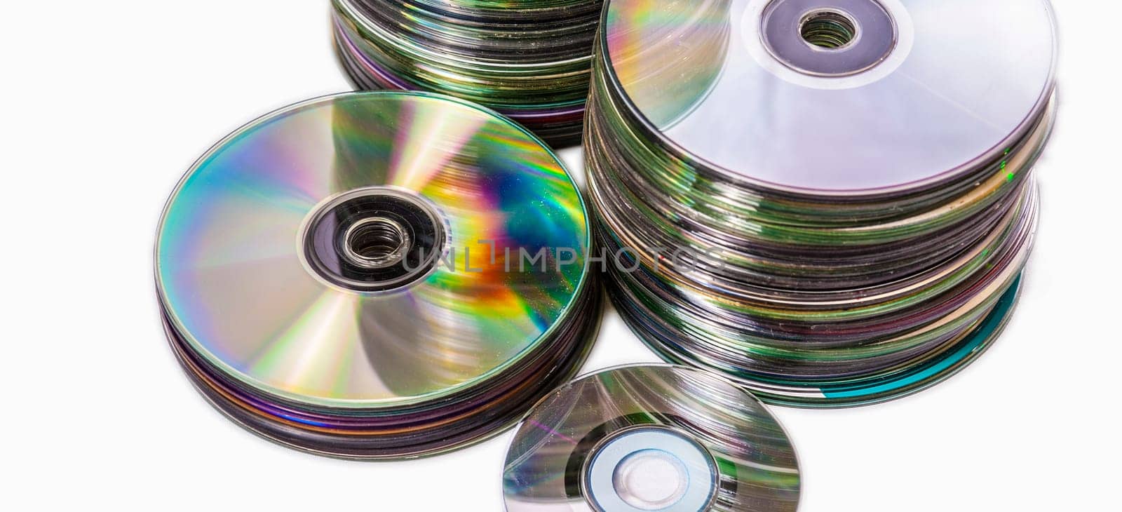 Heap of old used cd and mini disks. Isolated over white background