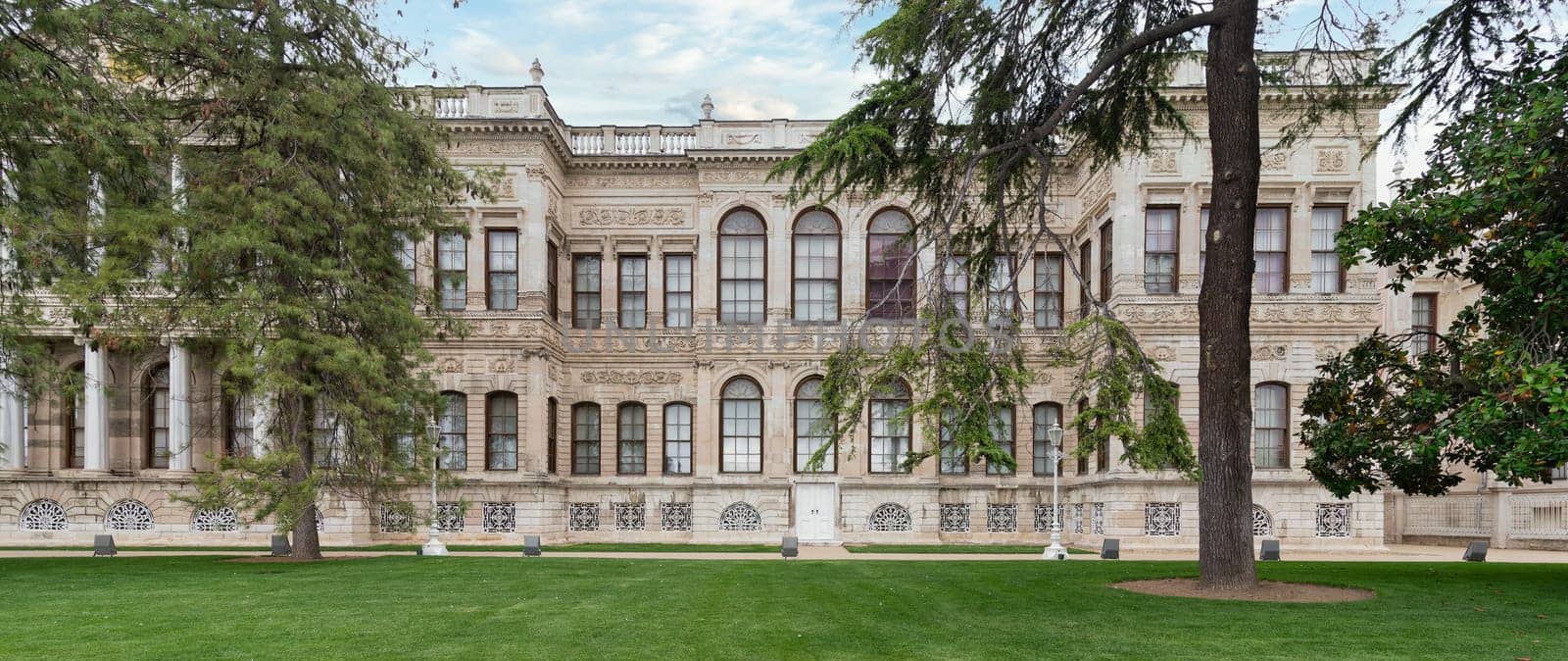 Side faced of Dolmabahce Palace, or Dolmabahce Sarayi, located in Besiktas district on the European coast of the Bosporus, main administrative center of the Ottoman Empire formerly, Istanbul, Turkey
