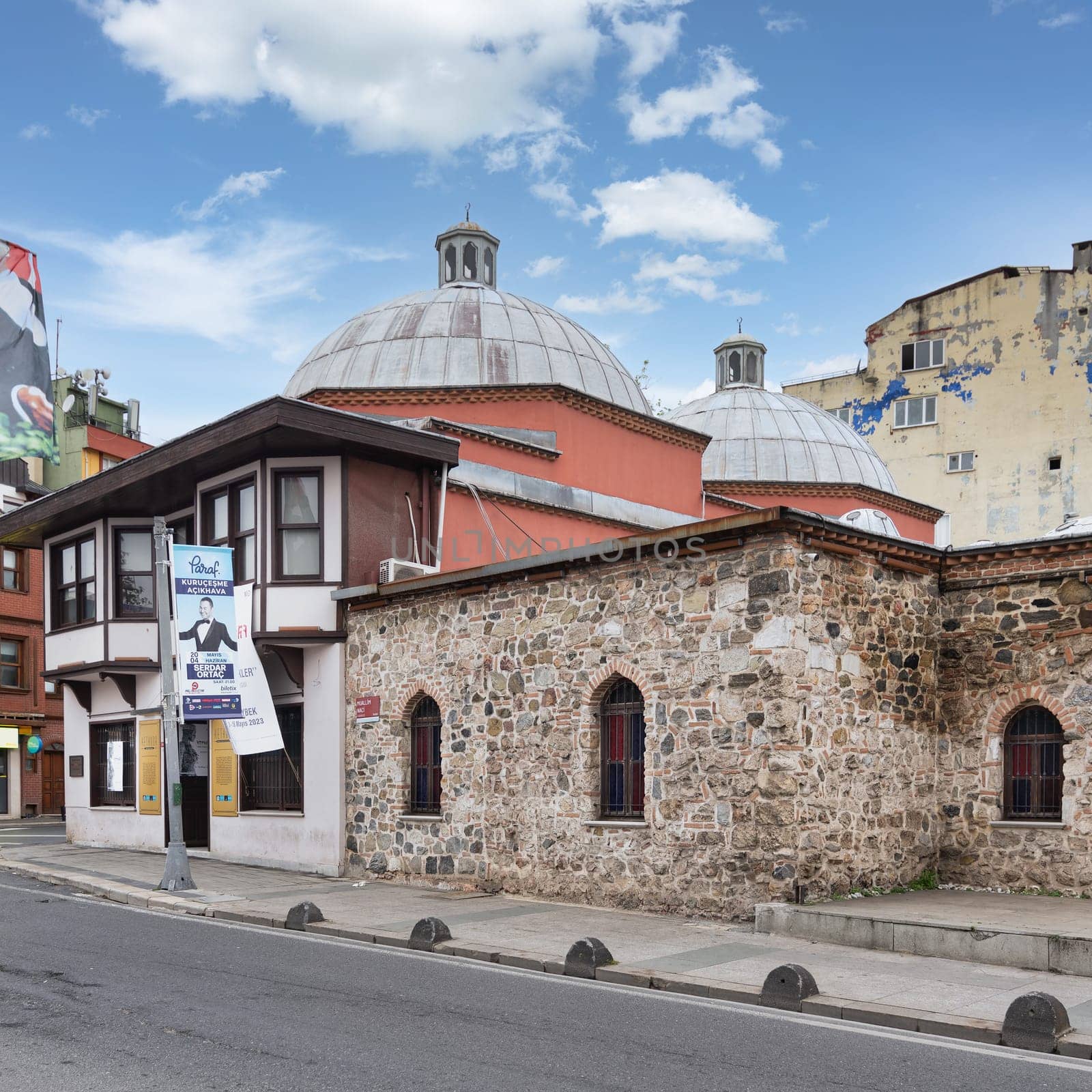 Istanbul, Turkey - May 12 2023: 17th century historic Husrev Kethuda Hamami, a Turkish bathhouse located in the Ortakoy district. The building is made of white stone and has a large dome in the center